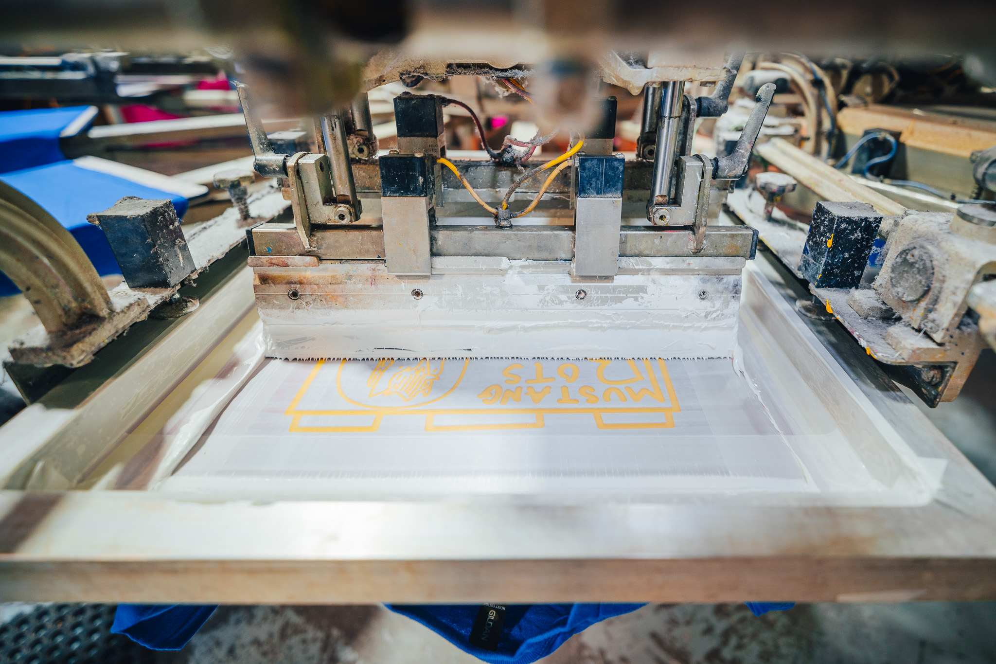 Close-up of one bay of a screen printing machine in the Norwest Graphics print facility