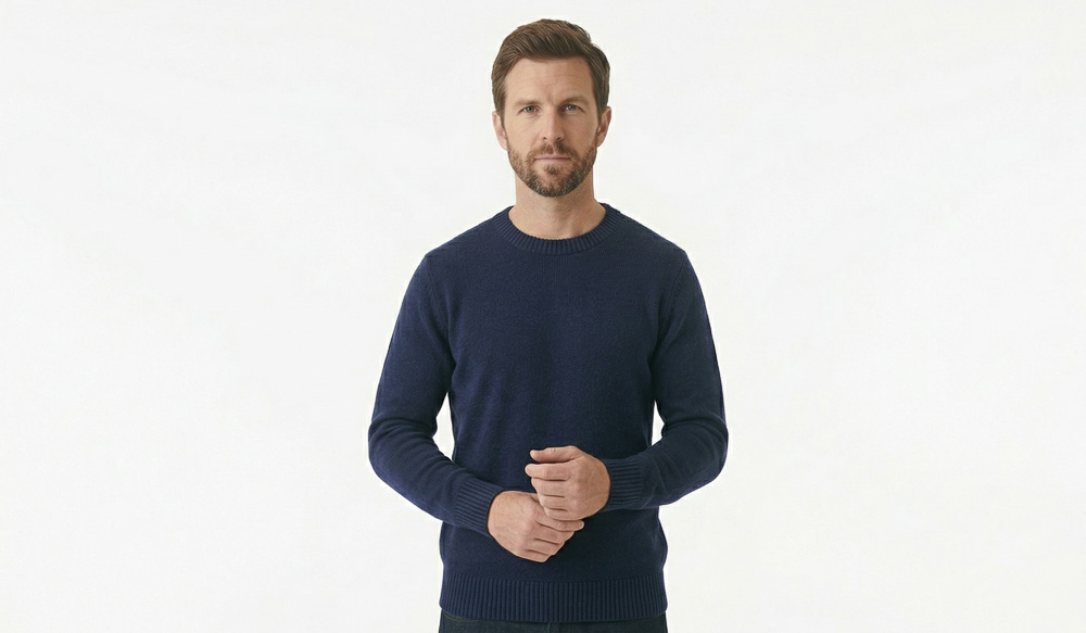 A man in a blank navy blue crew neck sweater