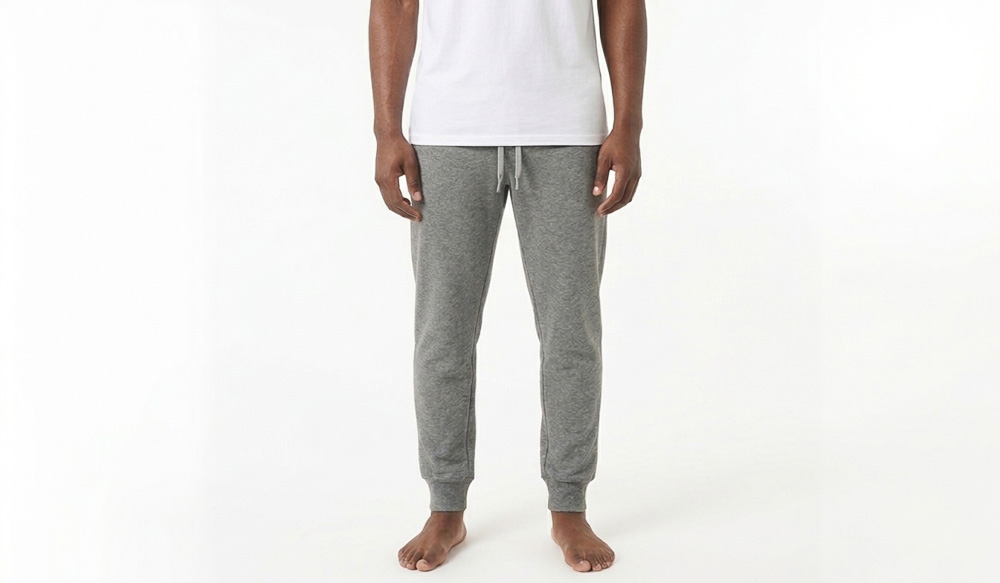 A man wearing blank grey sweatpants